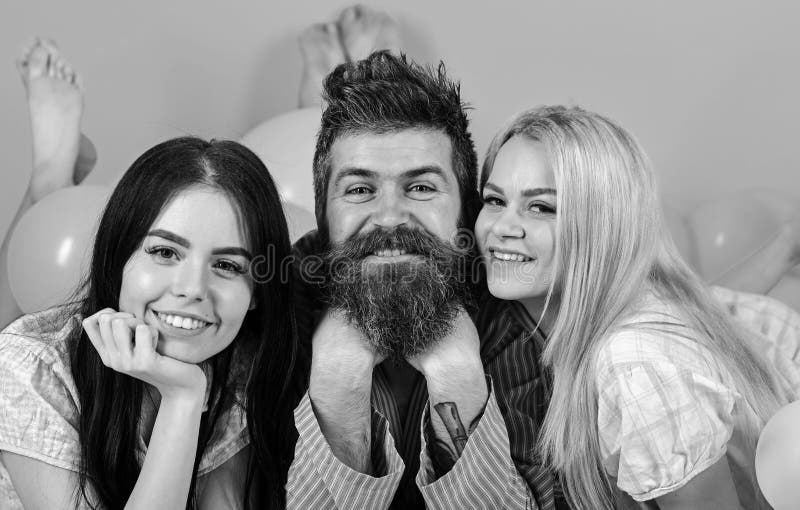 Man With Beard And Mustache Attracts Blonde And Brunette Girls Girls