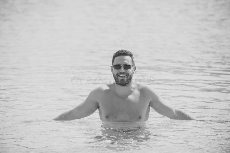Man standing waist deep in blue sea water royalty free stock image Man standing waist deep in blue sea water royalty free stock image