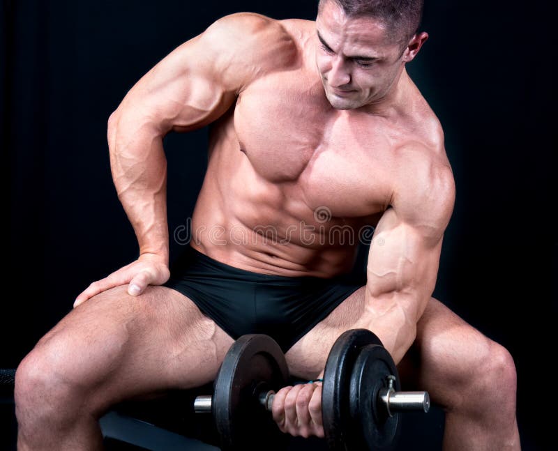 Man on bench with a bar weights in hands training