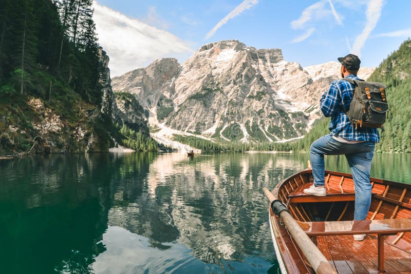 Man in Big Wooden Boat at Mountain Lake Stock Photo - Image of sitting ...