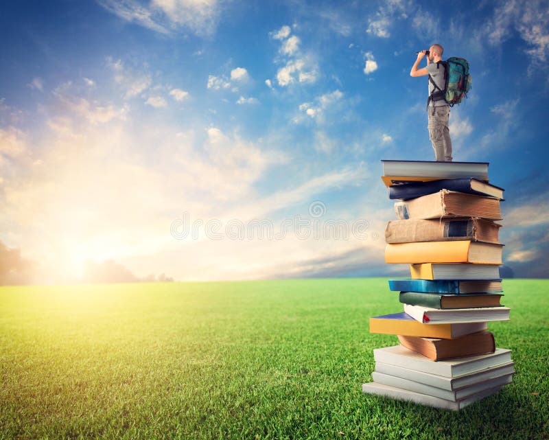 Man with binoculars over a pile of books observe a colorful sunrise. the culture open the imagination royalty free stock image Man with binoculars over a pile of books observe a colorful sunrise. the culture open the imagination royalty free stock image