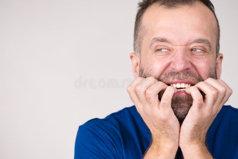 Man biting his nails stock photo. Image of habit, fear - 153813820
