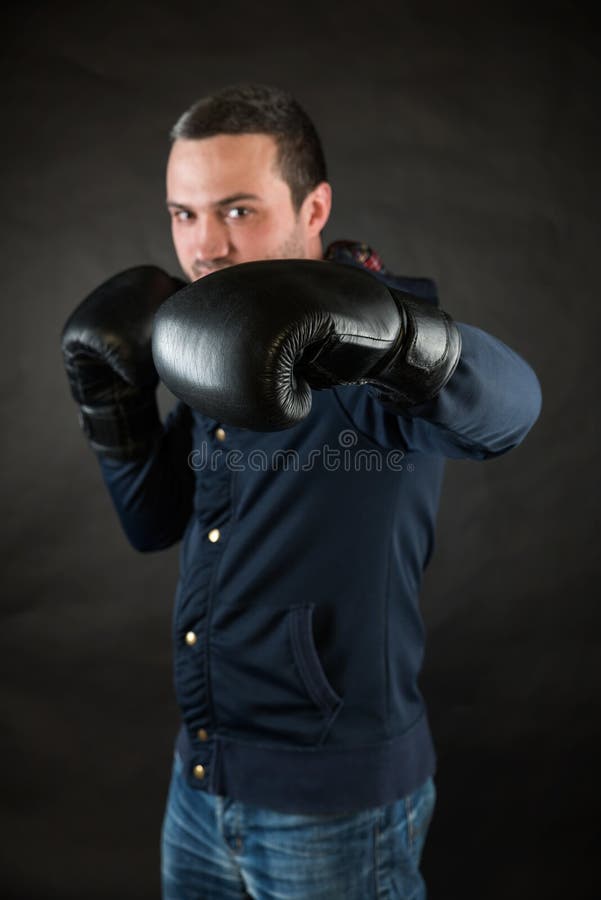 Man with Black Boxing Gloves. a Concept of a Challenge Stock Image