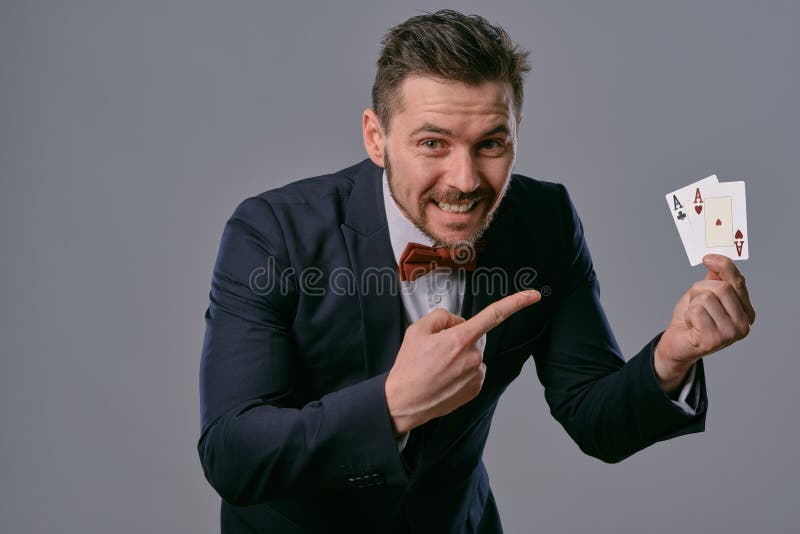 Young Business Man In Classic Black Suit White Shirt And Red Bowtie Posing  Against A Blue Studio Background Mock Up Copy Space Closeup Stock Photo -  Download Image Now - iStock