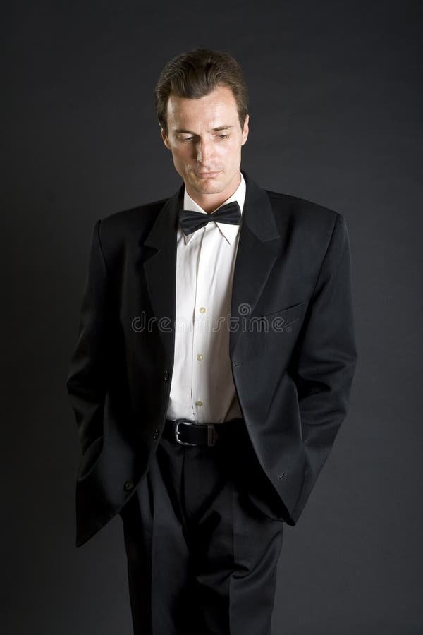 Man in black dinner jacket with bow tie