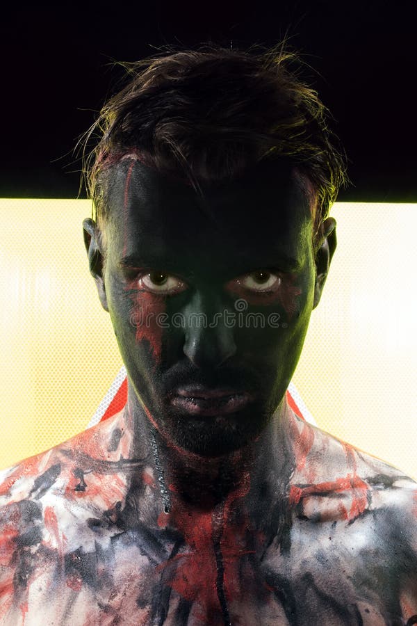 Man with black face and sullen look royalty free stock photography Man with black face and sullen look royalty free stock photography