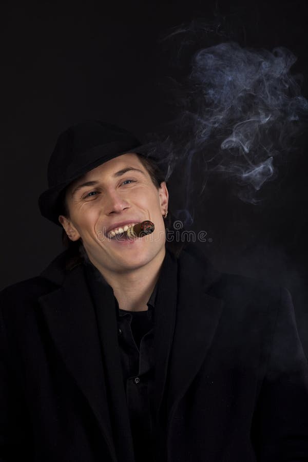 Man In Black Hat Smoke Cigar And Smile Royalty Free Stock Images