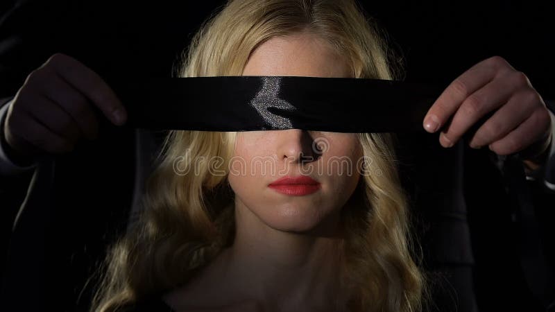 Beautiful woman portrait with blindfolded eyes. Submissive Stock Photo