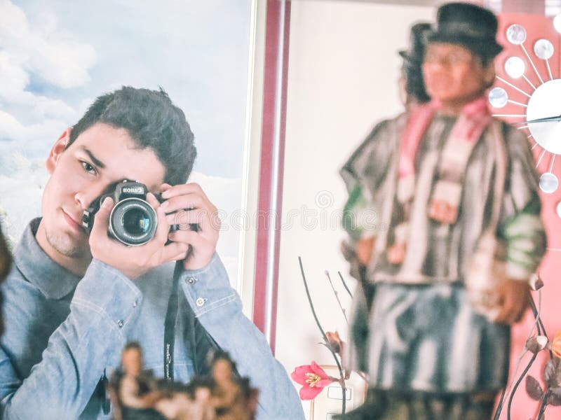 Man In Blue Denim Jacket Using Black Dslr Camera Free Public Domain Cc0 Image