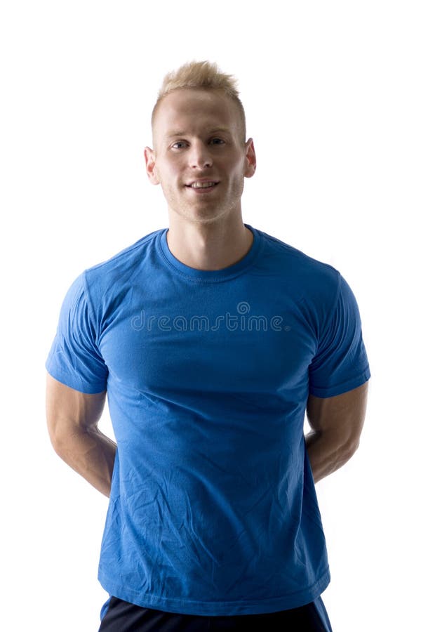 Handsome blond young man exercising pecs on gym equipment Fleece