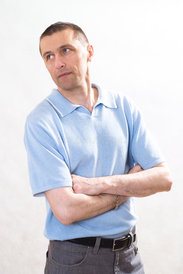 Man in a blue shirt standing