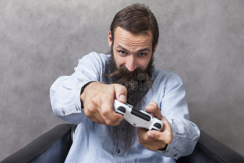 Man in blue shirt with video game controller stock photos Man in blue shirt with video game controller stock photos