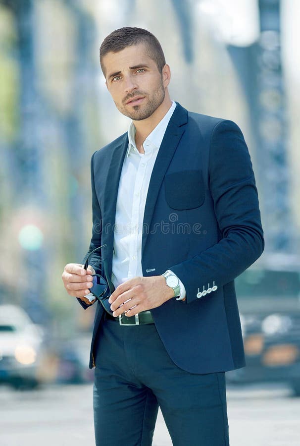 A Man in a Blue Suit Against a Street Background Stock Photo - Image of ...