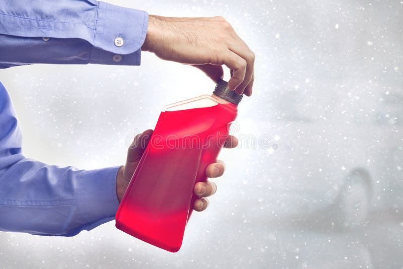 Man with a Bottle of Antifreeze Stock Image Image of automobile