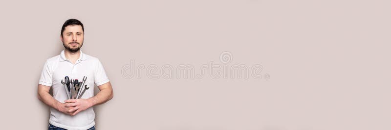 Man with bouquet of wrenches and screwdrivers banner royalty free stock images