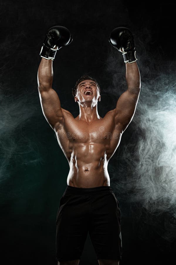 Man, Boxer Winner and Champion after Fight in Gloves on Black Background  Celebraiting Flawless Victory. Fitness and Stock Photo - Image of health,  muscular: 163897408