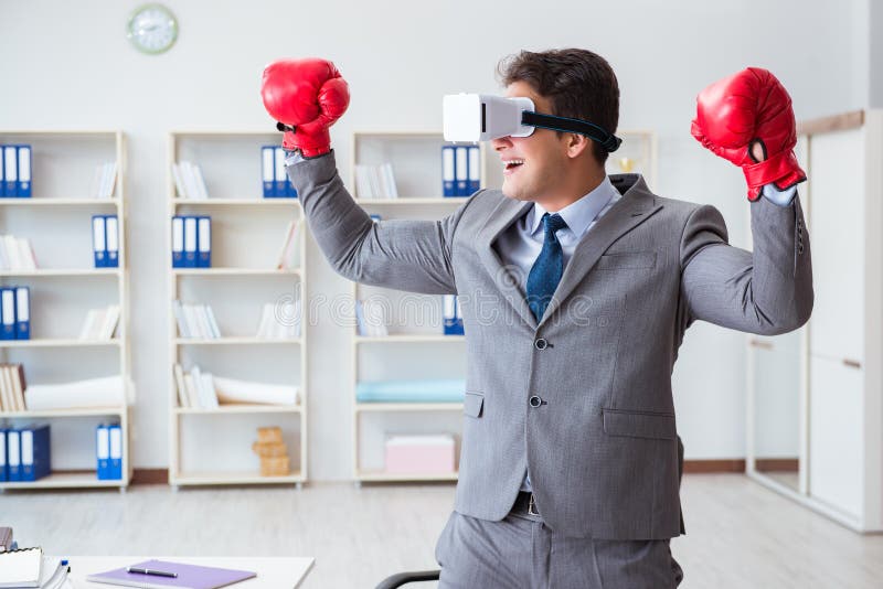 The Man Boxing in the Office with Virtual Reality Goggles Stock Photo