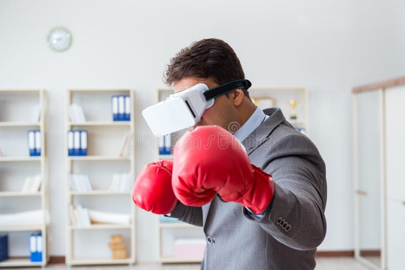 The Man Boxing in the Office with Virtual Reality Goggles Stock Photo
