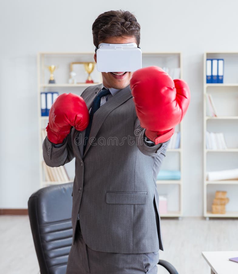 Man Boxing in the Office with Virtual Reality Goggles Stock Image