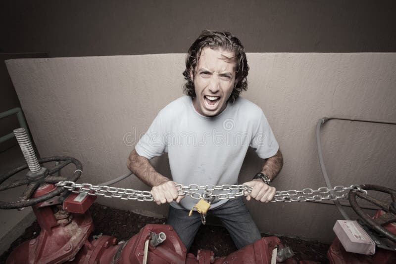 Man breaking the chains stock photo. Image of chains 10582730