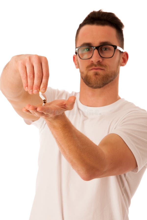 Man Breaking Cigarette As a Gesture of Quitting Smoking. Stock Photo