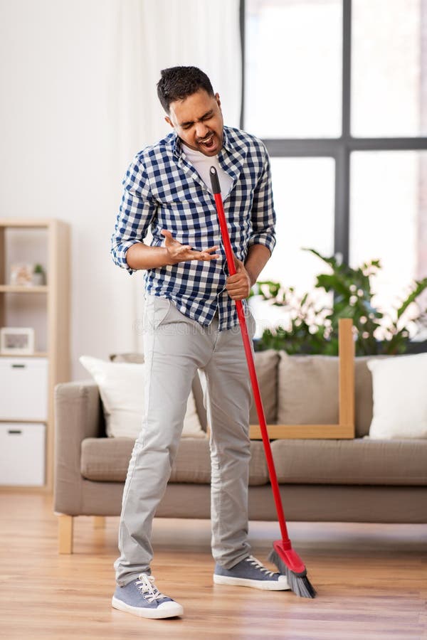 Man with Broom Cleaning and Singing at Home Stock Image - Image of ...
