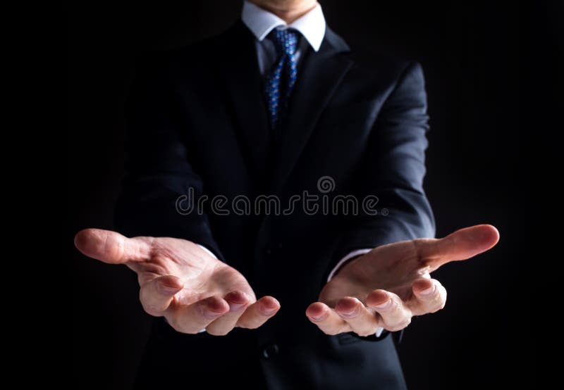 Free Photo  Mature man pretending to show something in shirt