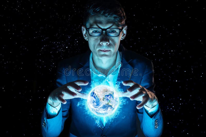 Man businessman holding hands over a blue glowing sphere in the form of planet earth. Elements furnished by NASA stock photography Man businessman holding hands over a blue glowing sphere in the form of planet earth. Elements furnished by NASA stock photography