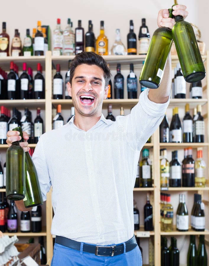 Man buying bottle of wine stock photo. Image of enjoying 82553950