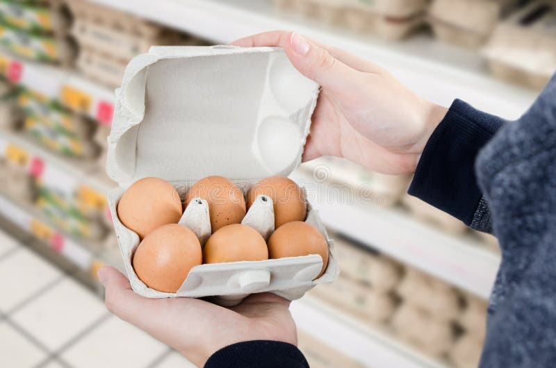 Egg store supermarket price expensive grocery shop concept stock photos.