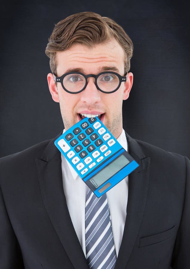 Man with calculator in mouth against navy chalkboard stock illustration