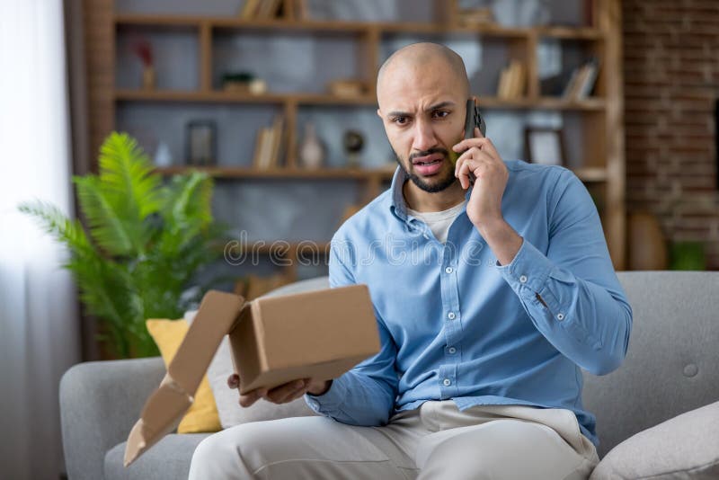 Man calling customer service about wrong package delivery royalty free stock images