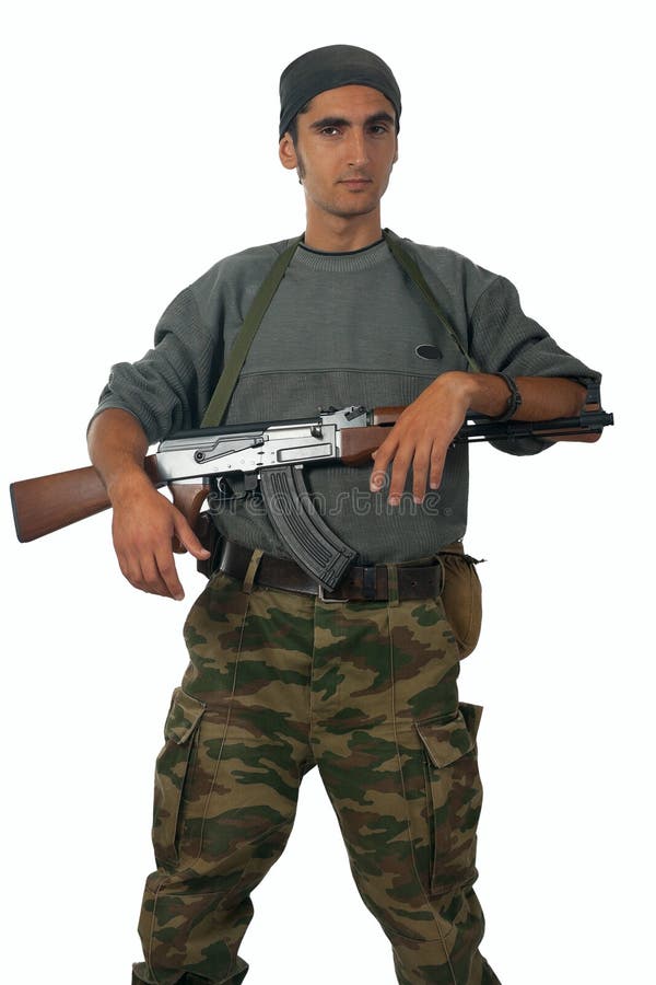 Man in camouflage with gun.