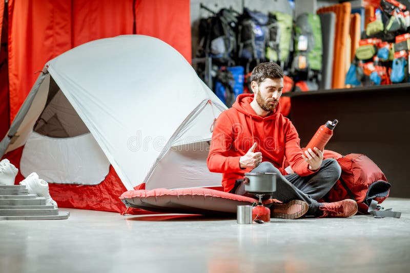 Man with Camping Tools and Tent in the Shop Stock Image - Image of ...