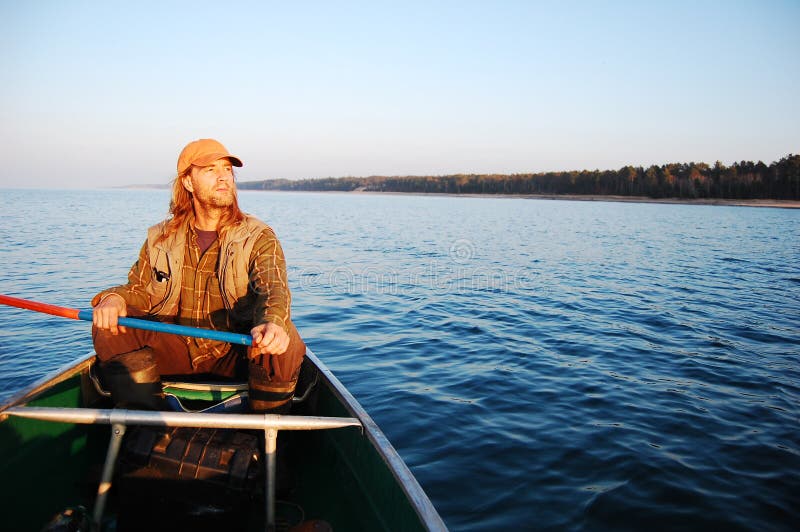 Man Canoeing stock photo. Image of paddle, outdoors, season 16599660