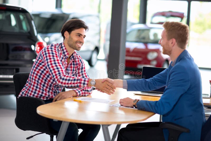 Man at a Car Dealership Buying an Auto Stock Photo Image of people