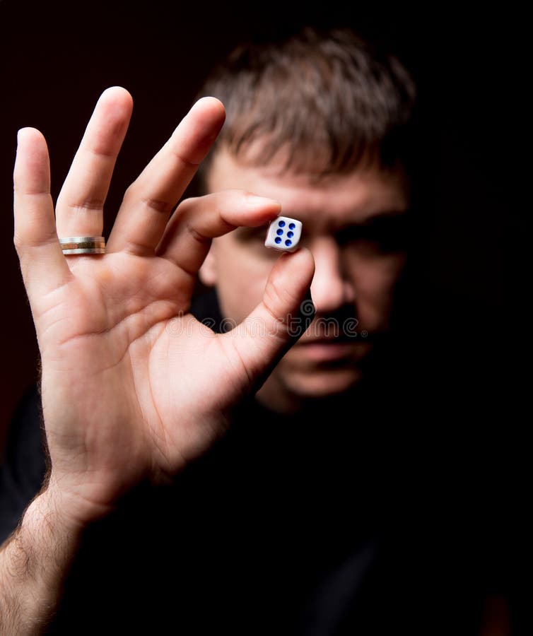 A Man is Sitting on Dice and Thinking about Money on a White Background