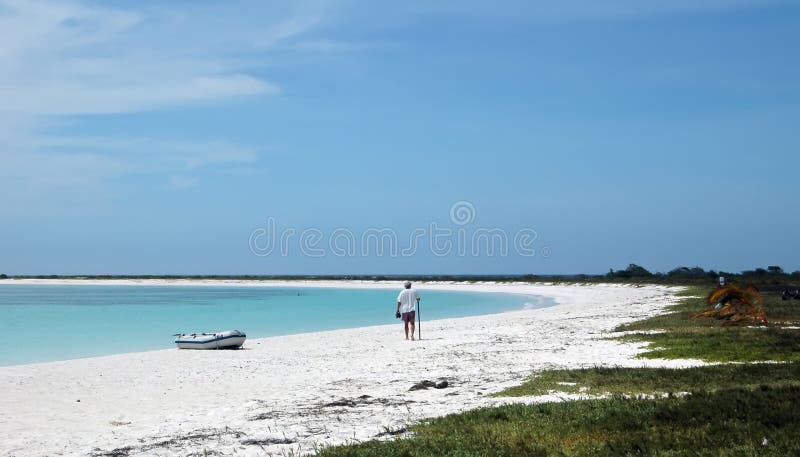 Man on Caribbean white sand beach