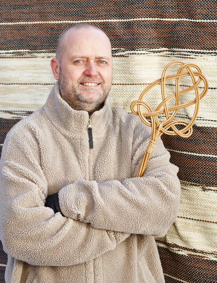 Man and carpet beater stock image. Image of warm, beard 50292451