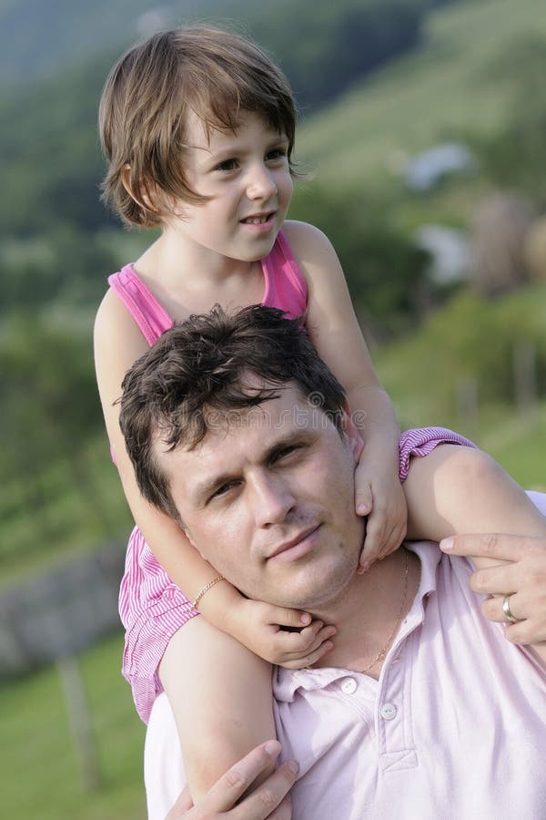 Man carrying girl stock photography