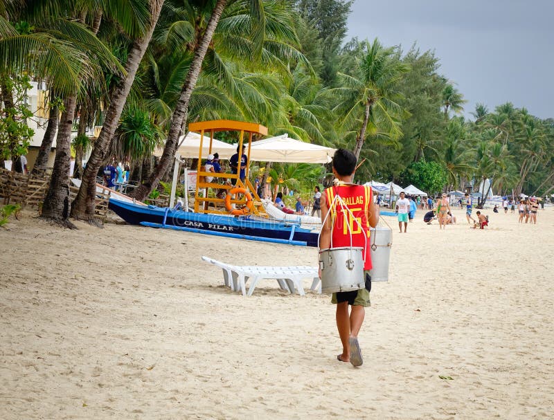 A man carrying goods on shoulder in Boracay, Philippines. Philippines atm machine stock images, royalty-free photos and pictures