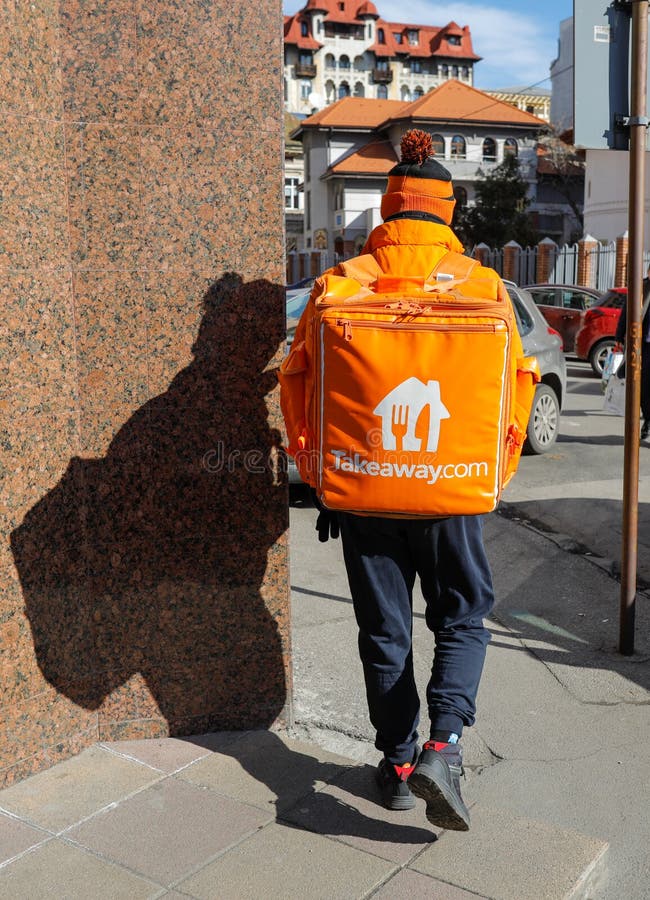 Man carrying a Takeaway delivery backpack on the streets of Bucharest