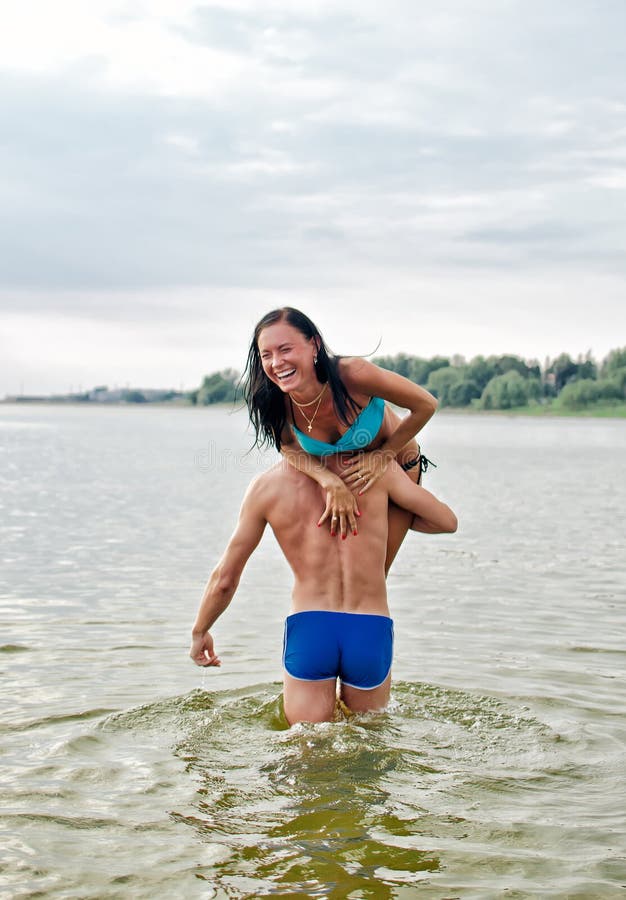 Man carrying woman