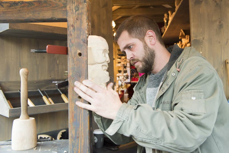 Man carving mask editorial photography. Image of decor 47238182