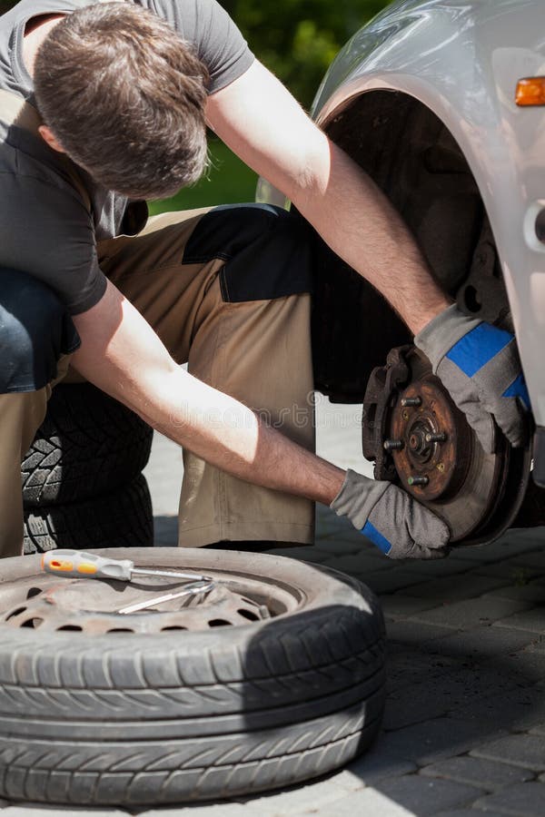 Repairing Brakes on Car stock image. Image of replace 40933557