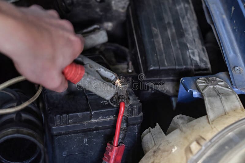 A Man Charges a Battery in a Car Using Charging Stock Image Image of