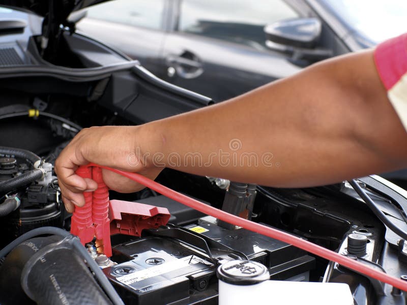 Man Charging Car Battery Using Jumper Cables Stock Image Image of