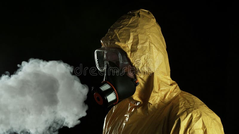 Man in chemical suit with respirator and goggles. Portrait of a man in chemical suit with respirator and goggles. Concept of protection against viruses royalty free stock image Man in chemical suit with respirator and goggles. Portrait of a man in chemical suit with respirator and goggles. Concept of protection against viruses royalty free stock image