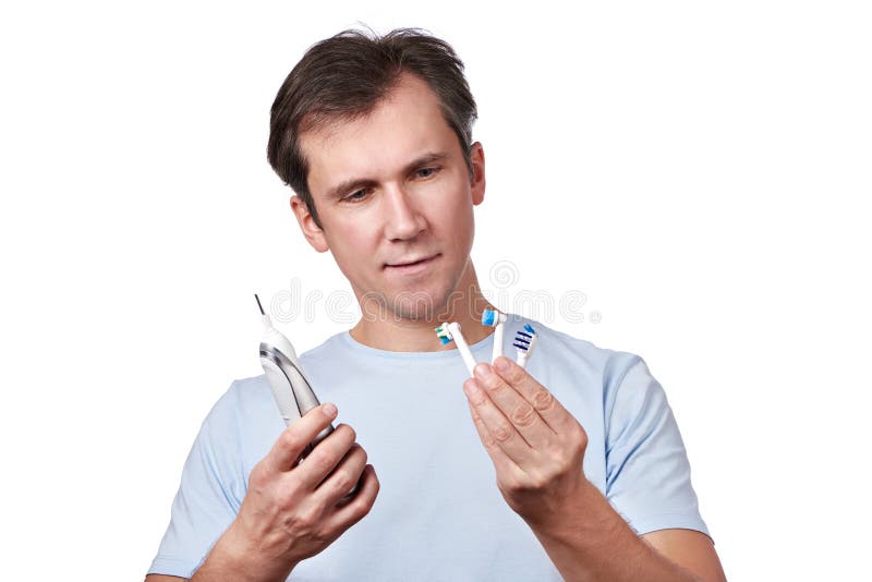 Man Chooses Changeable Head for Electric Toothbrush Stock Image Image
