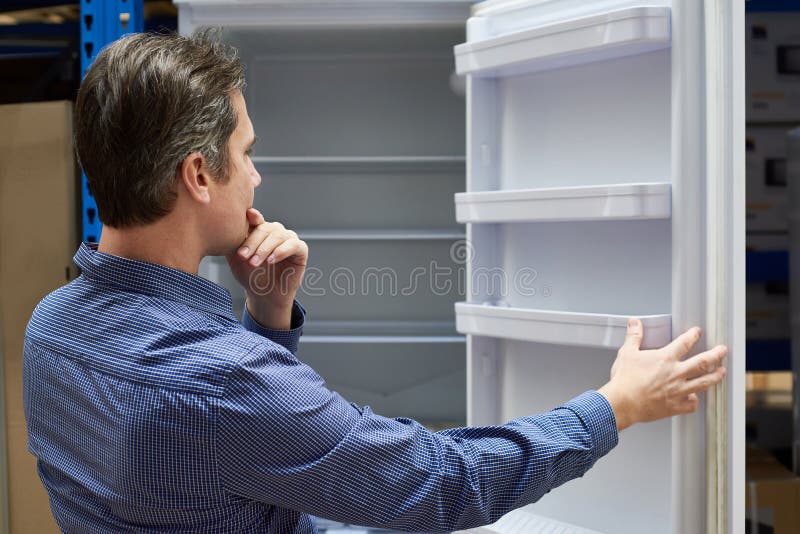 Man Chooses Refrigerator in Store Stock Photo Image of customer